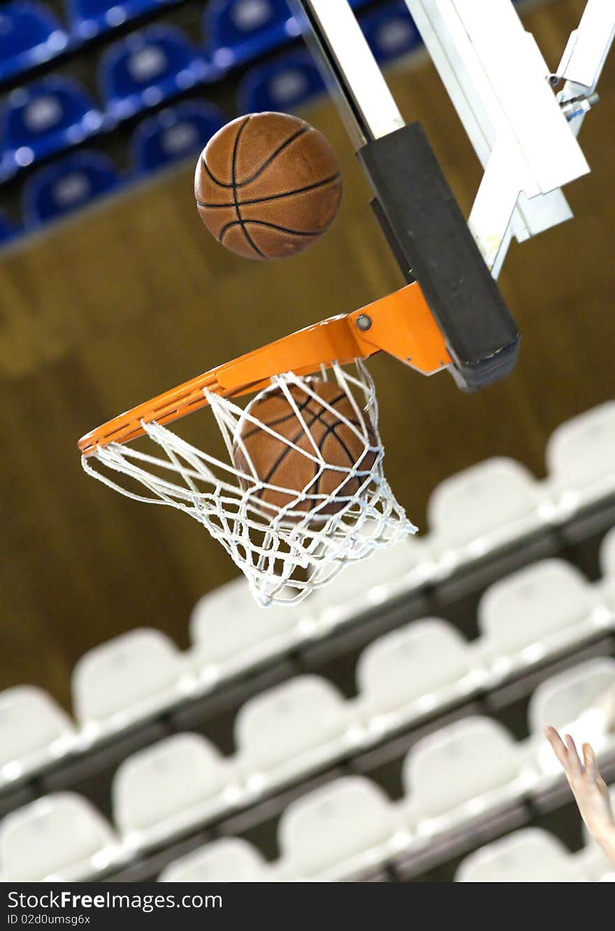 Basketball ball falling in hoop. Basketball ball falling in hoop