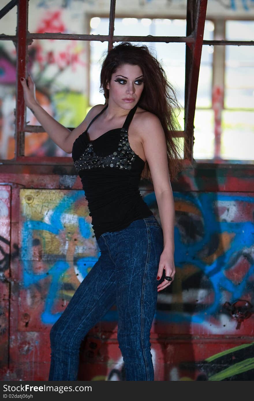 Model in an urban area full of graffiti. Model in an urban area full of graffiti