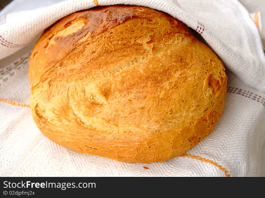 Bread closeup in rustic tablecloth.