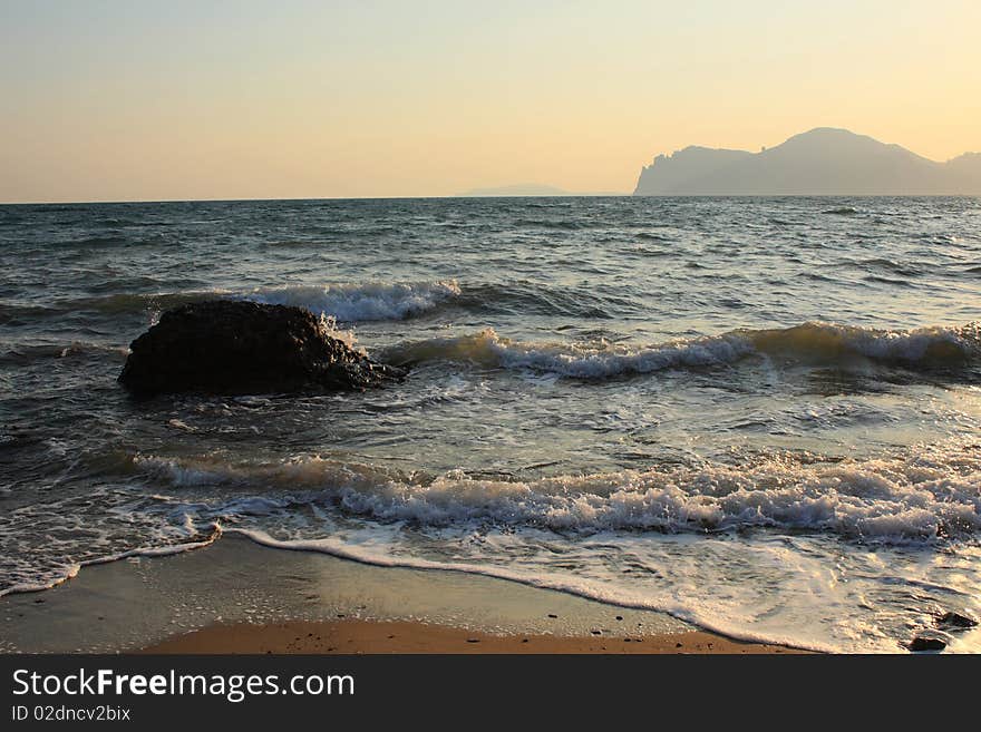 Evening beach - beautiful waves at sunset. Evening beach - beautiful waves at sunset