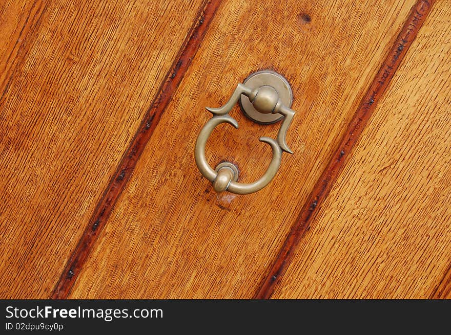 Brown wooden door in Amsterdam city