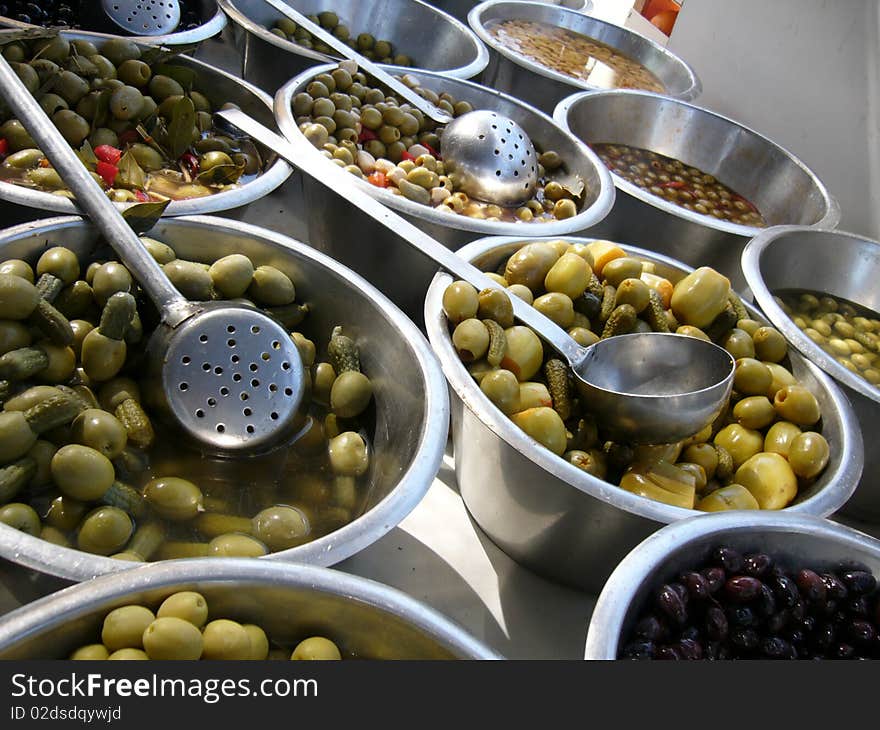 Green olives for sale on the Sunday market El Pozo in Madrid /Spain/. Green olives for sale on the Sunday market El Pozo in Madrid /Spain/