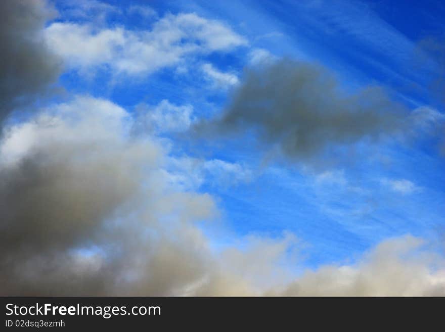 Big black clouds approaching a calm area. Big black clouds approaching a calm area