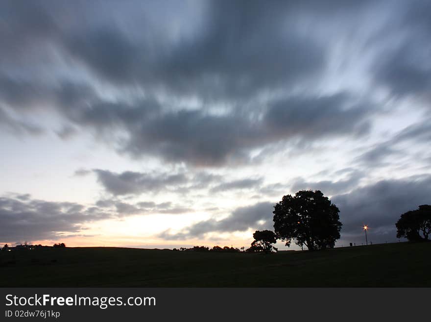 Clouds flowing with wind at dusk. Clouds flowing with wind at dusk