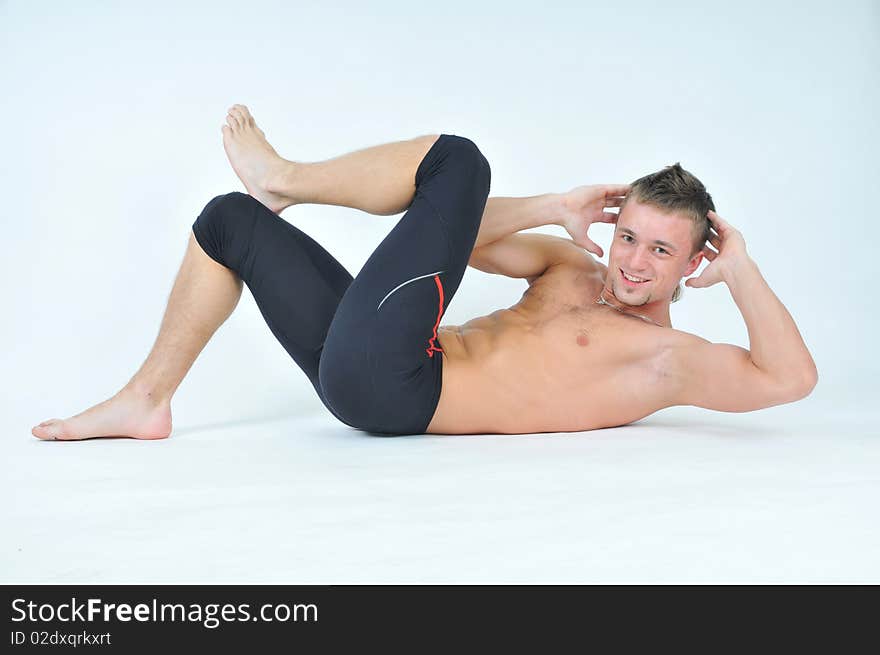 Muscled male model posing in studio. Muscled male model posing in studio