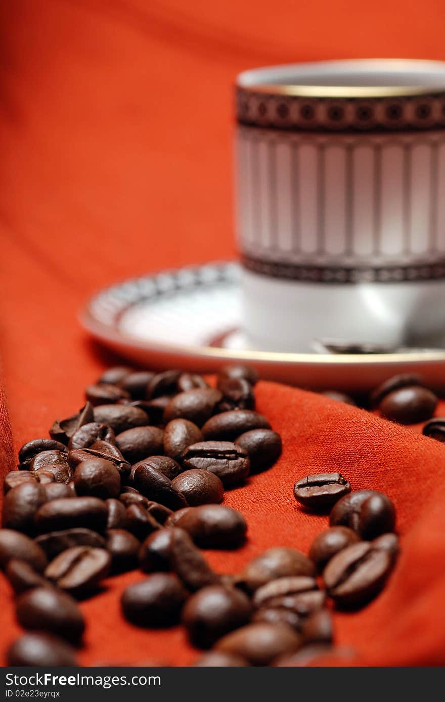 Coffee beans and coffee cup