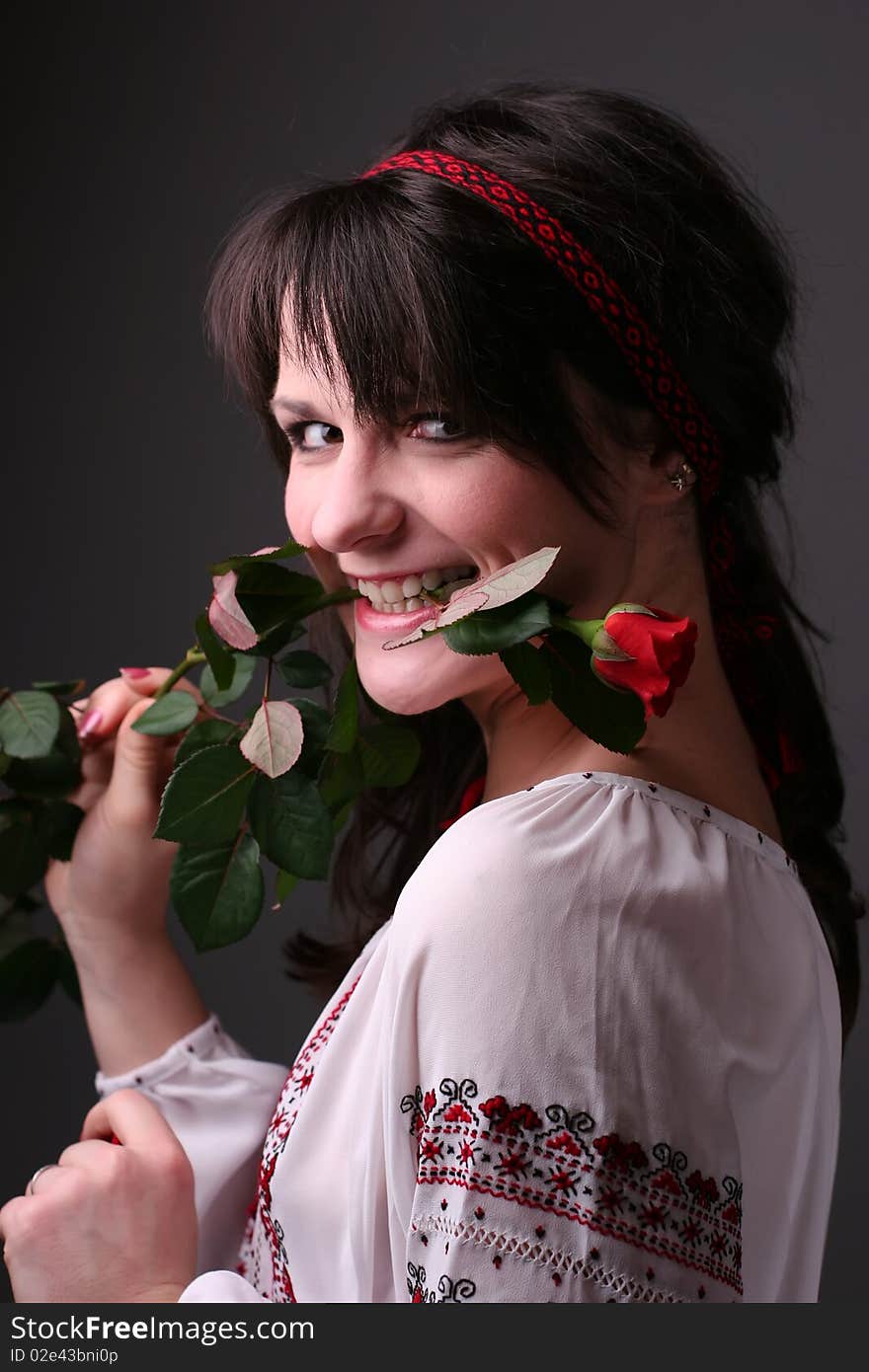 Young girl in traditional (national) ukrainian dress with a rose. Young girl in traditional (national) ukrainian dress with a rose