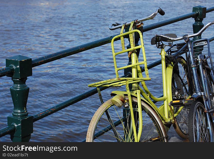 Two bikes at a waterway in Amsterdam