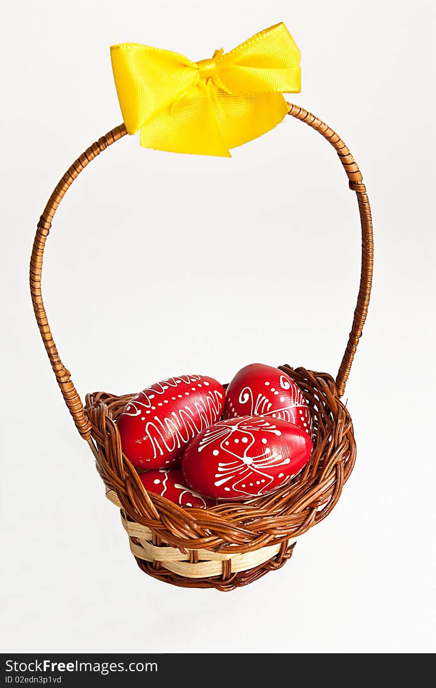 Easter egg basket with yellow ribbon on white background. Easter egg basket with yellow ribbon on white background