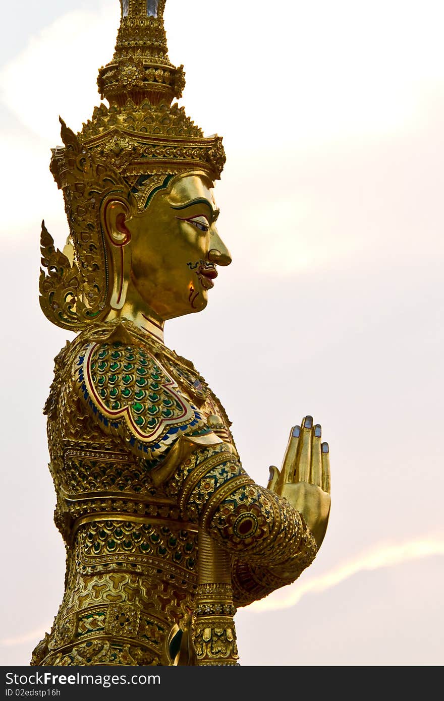 The guardian angel statue standing before a pagoda, Amphawa, Thailand