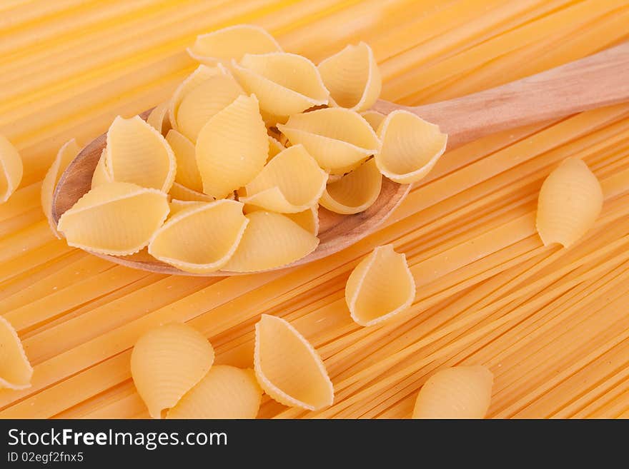 Italian pasta in a wood spoon