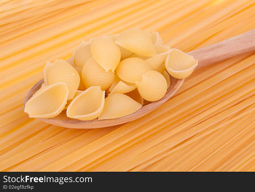 Italian pasta in a wood spoon