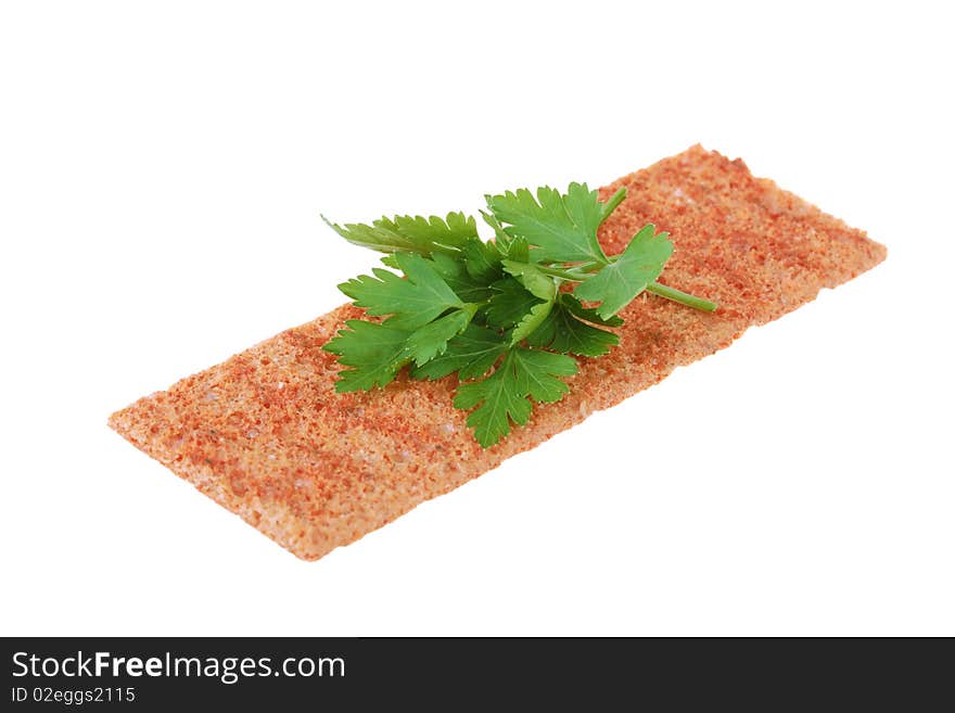 Thin crispbread with parsley isolated on white background