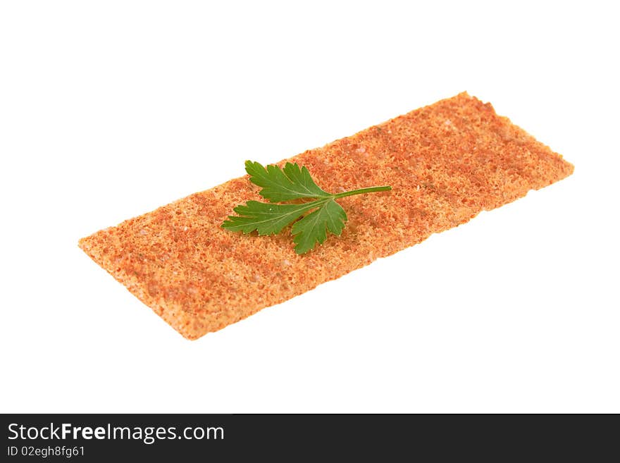 Thin crispbread with parsley isolated on white background