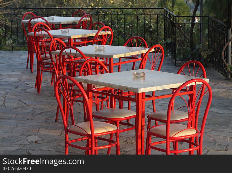 Still life with red chairs and tables, Lesbos, Greece