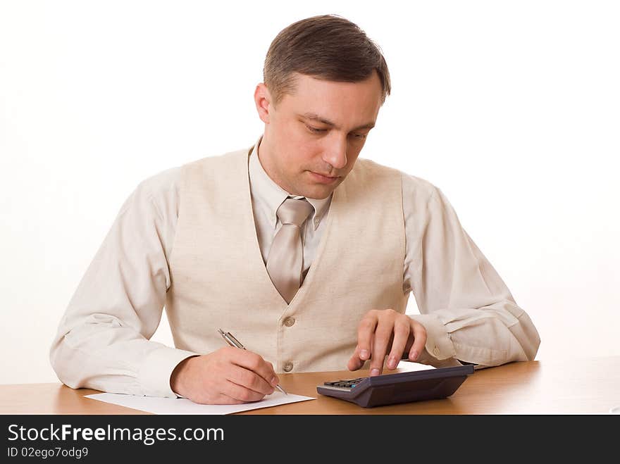 Young handsome businessman finds a table on a white background