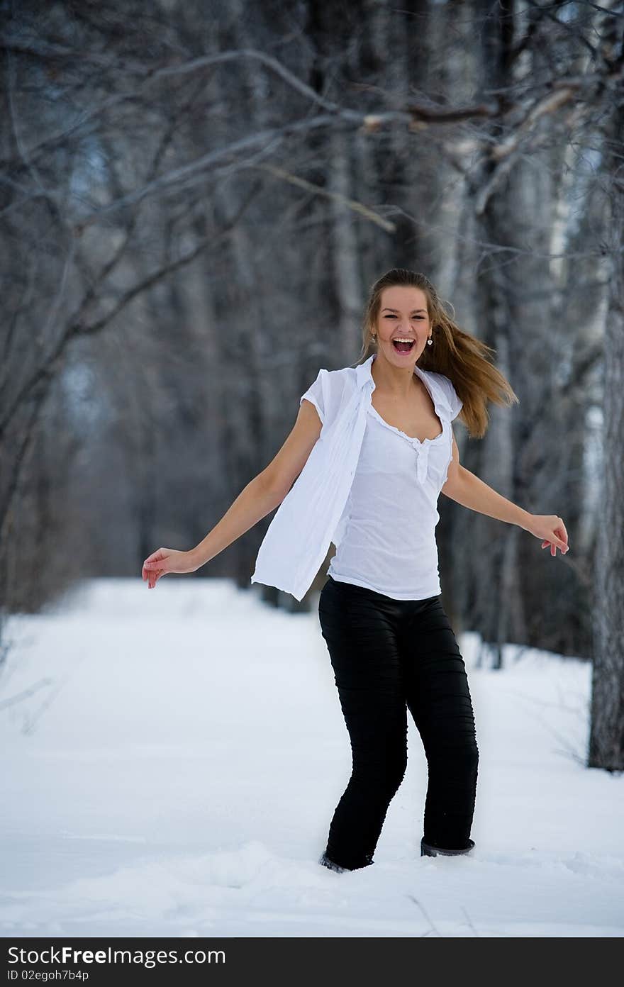 Picture of beautiful fashion model in winter forest