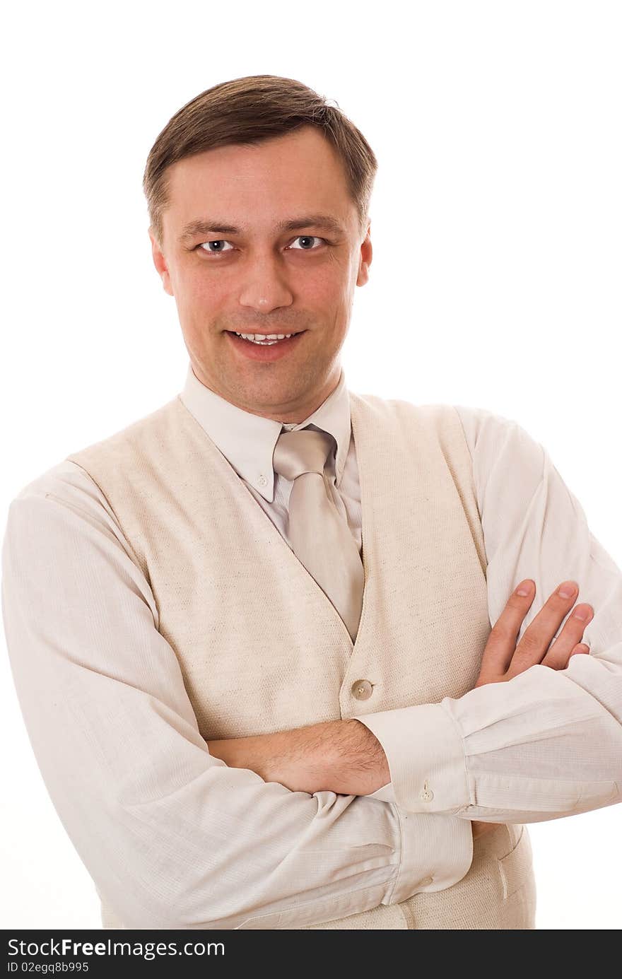 Handsome young businessman standing and smiling on white background