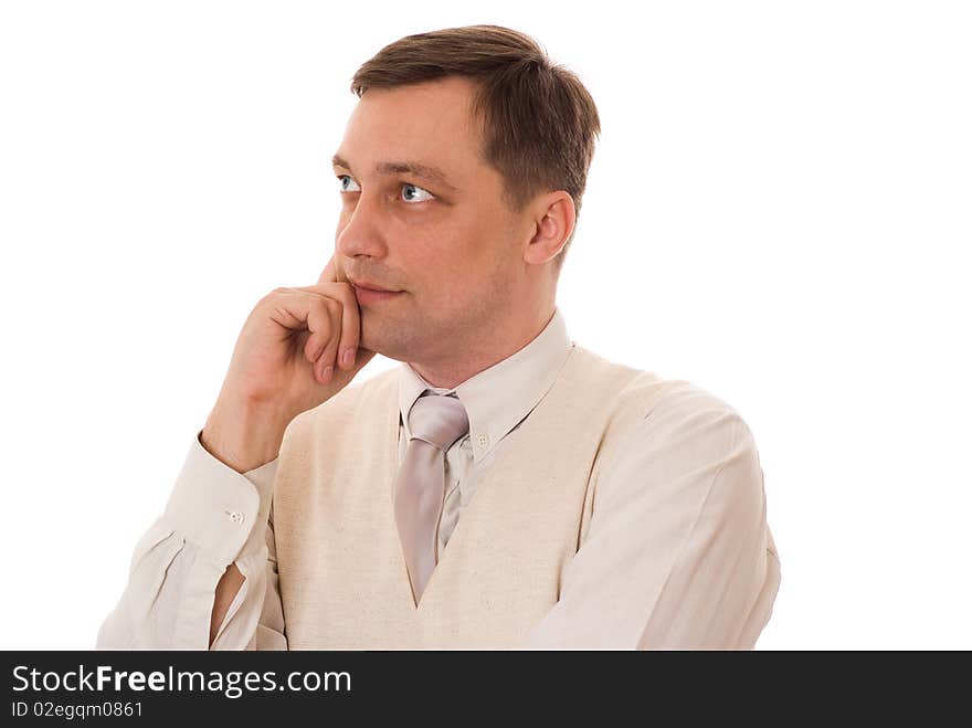 Young serious businessman standing on white background