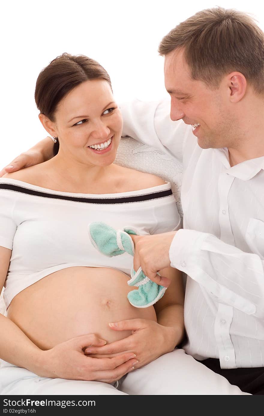 Young man with his pregnant wife were sitting. Young man with his pregnant wife were sitting