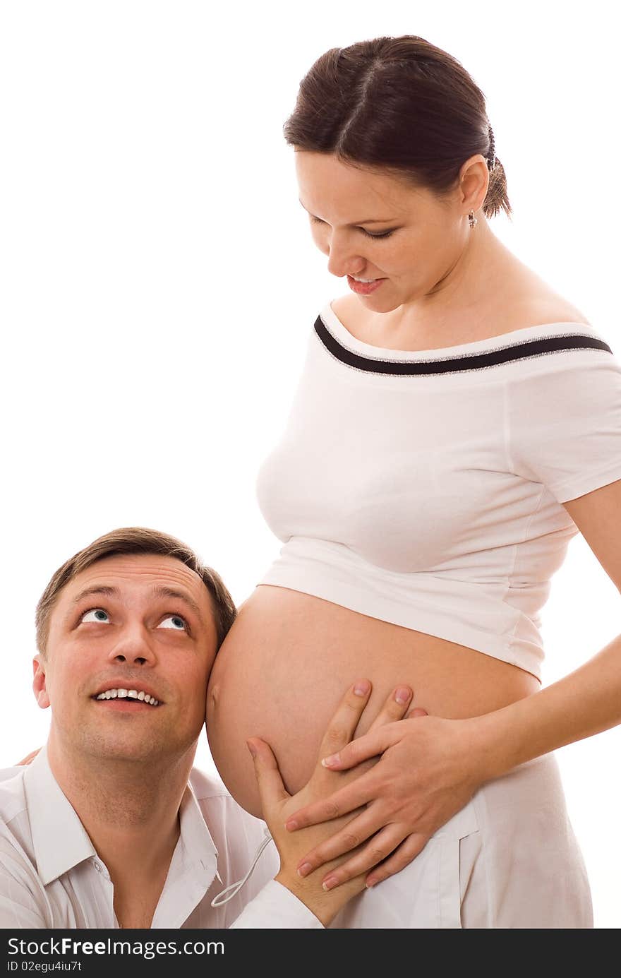 Man with his pregnant wife together on a white background. Man with his pregnant wife together on a white background