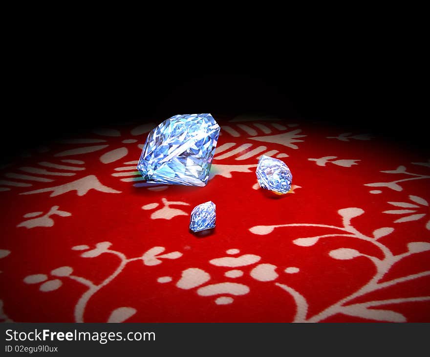 Three shiny diamonds on a white stamped red  tissue. Three shiny diamonds on a white stamped red  tissue