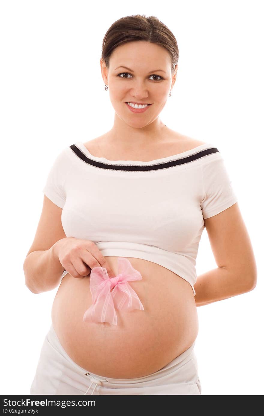 Beautiful pregnant woman holding a bow on his stomach