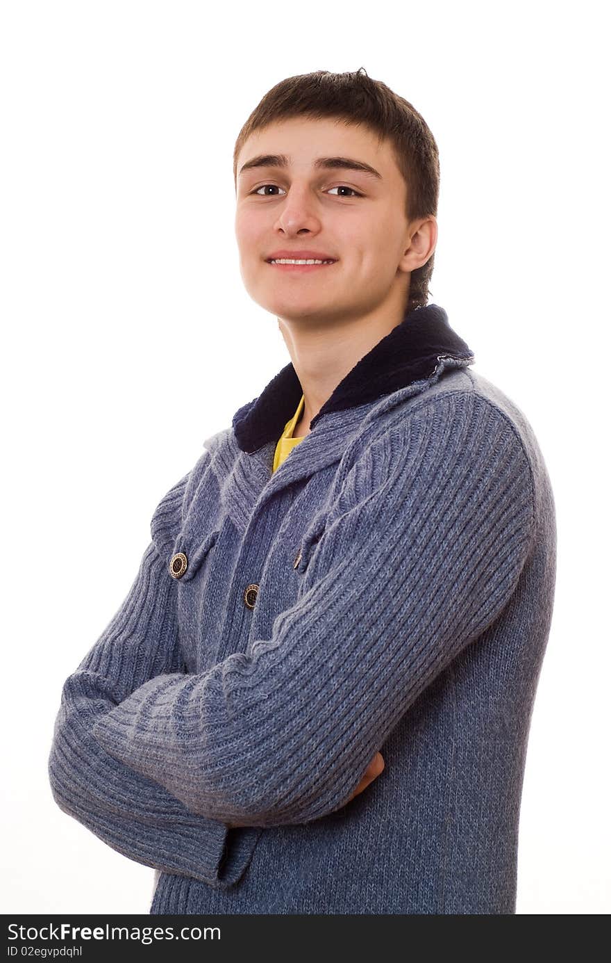 Handsome young man standing and smiling on white background