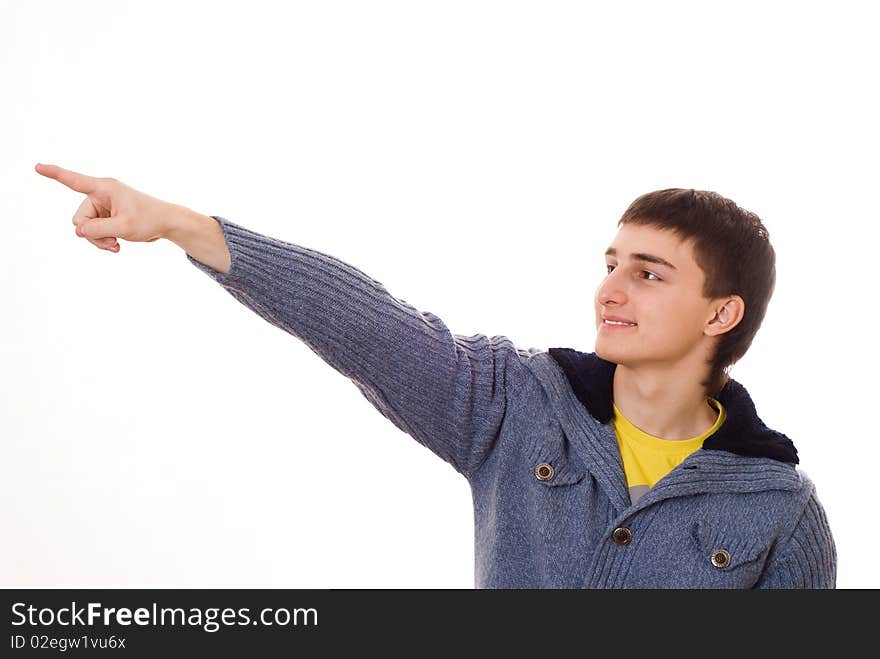 Handsome young teenager standing on a white