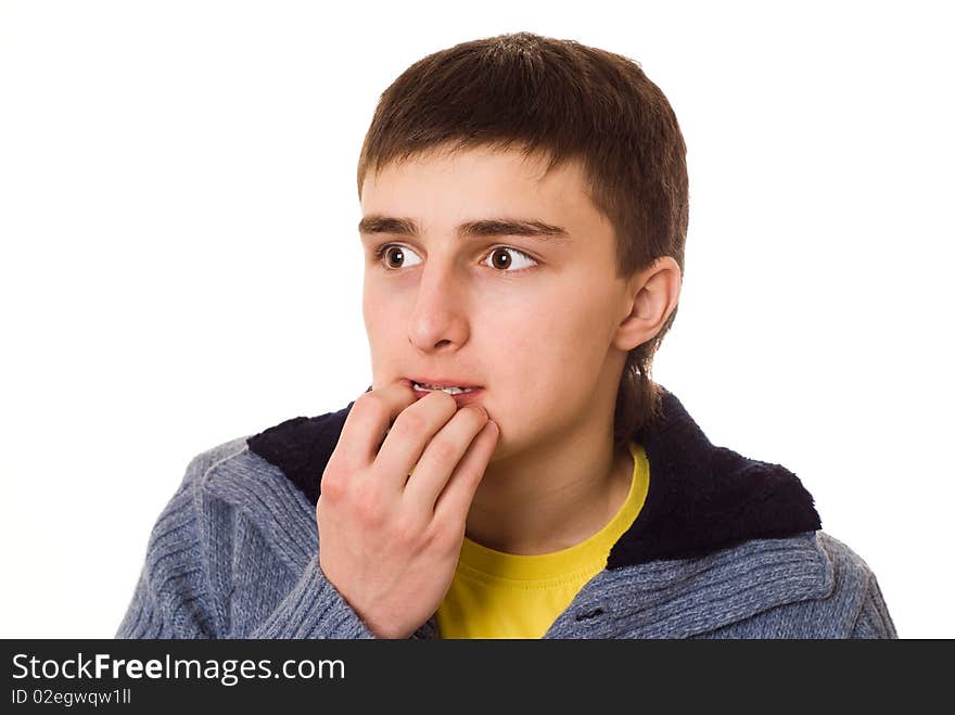 Teenager standing and thinking on a white background