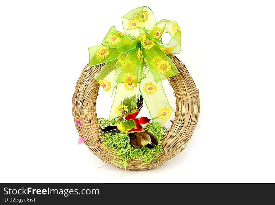 Easter wreath with green ribbon and red bird isolated on white