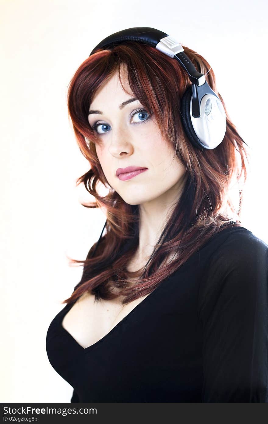 Woman with headphones isolated high key portrait