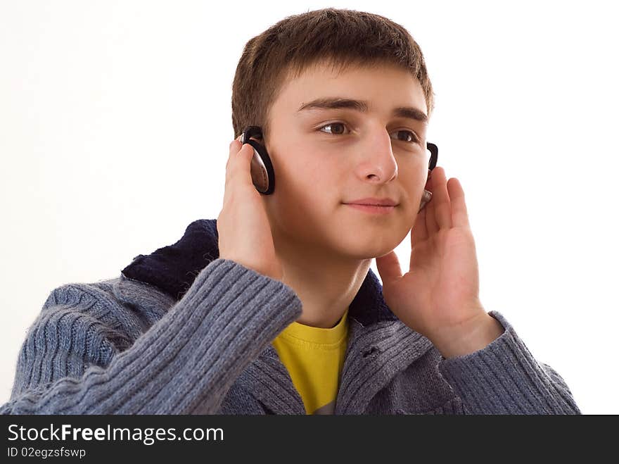 Teenager In A Blue Blouse With Headphones On White