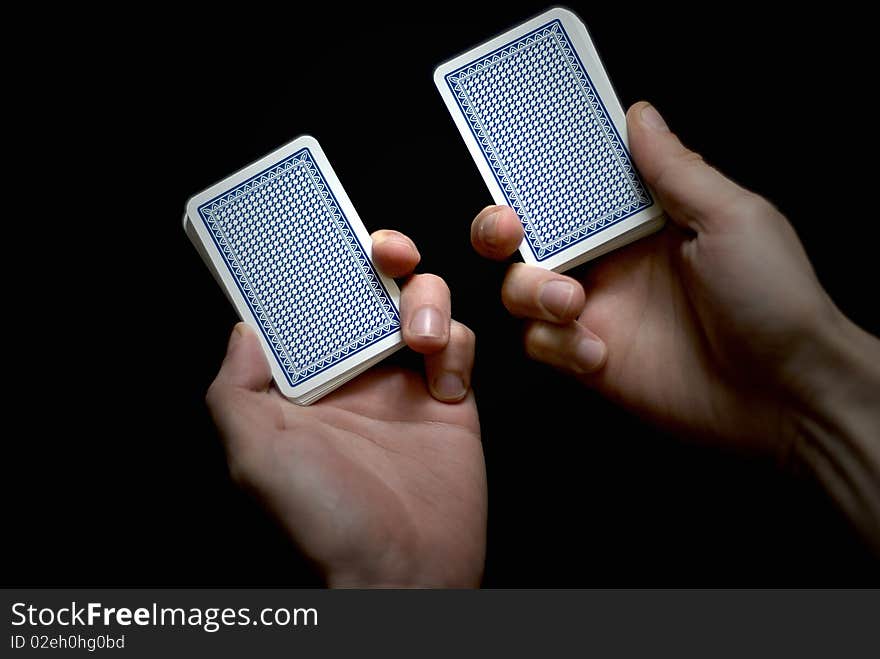 Playing cards on the black background