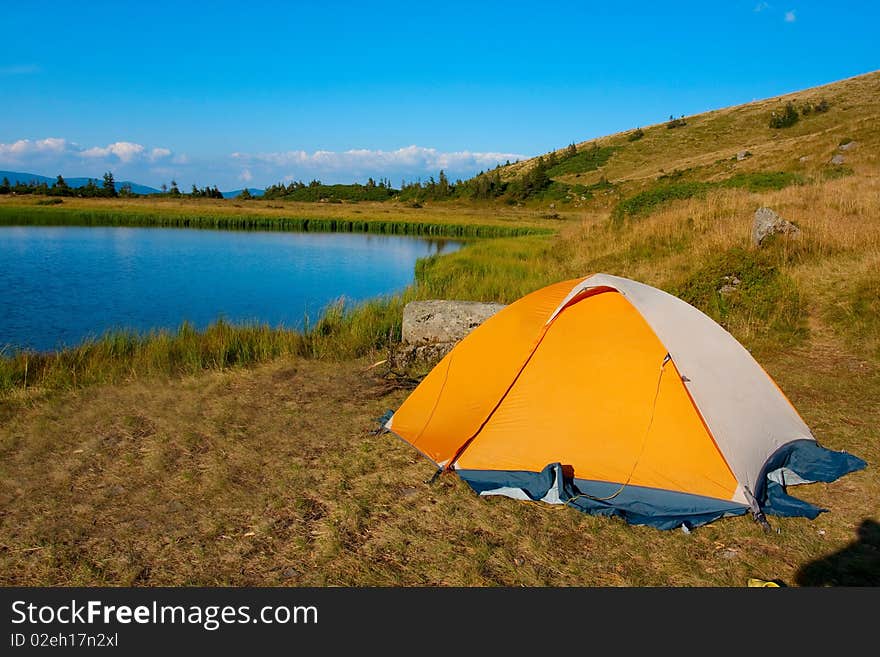 Orange tent in Carpathian mountain