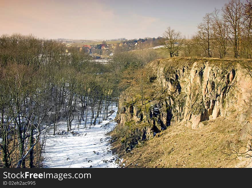 View from the cliff into a ravine in the winter