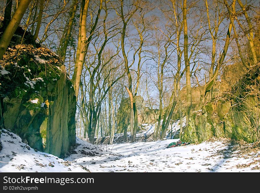 Passageway between boulders in the forest in the winter