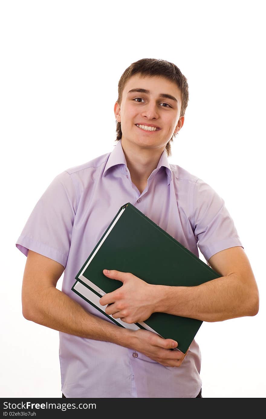 Handsome young student holds a book on white background