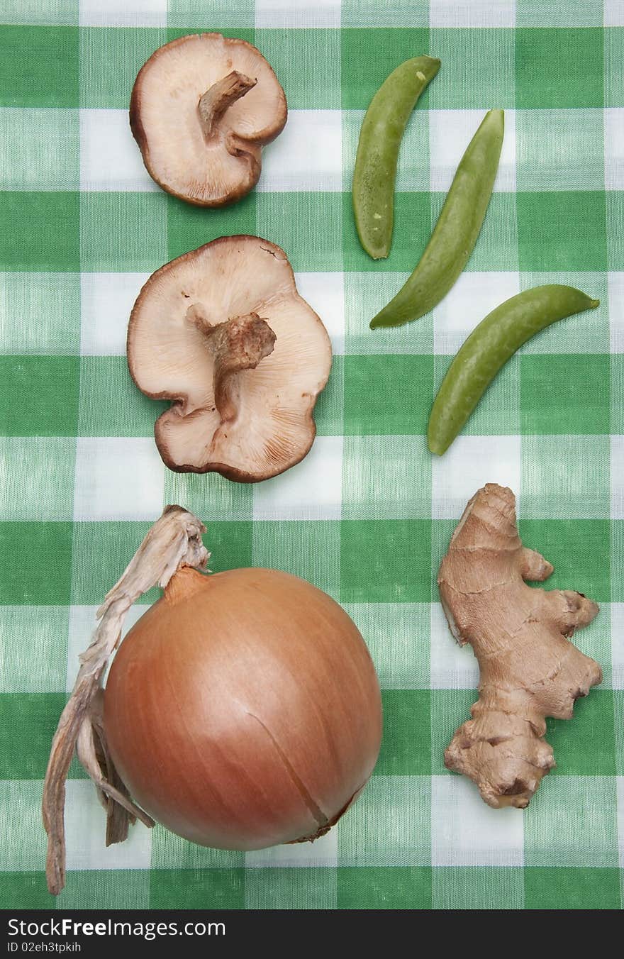 Group of Vegetables on a Green Checkered Cloth Ready for a Picnic.