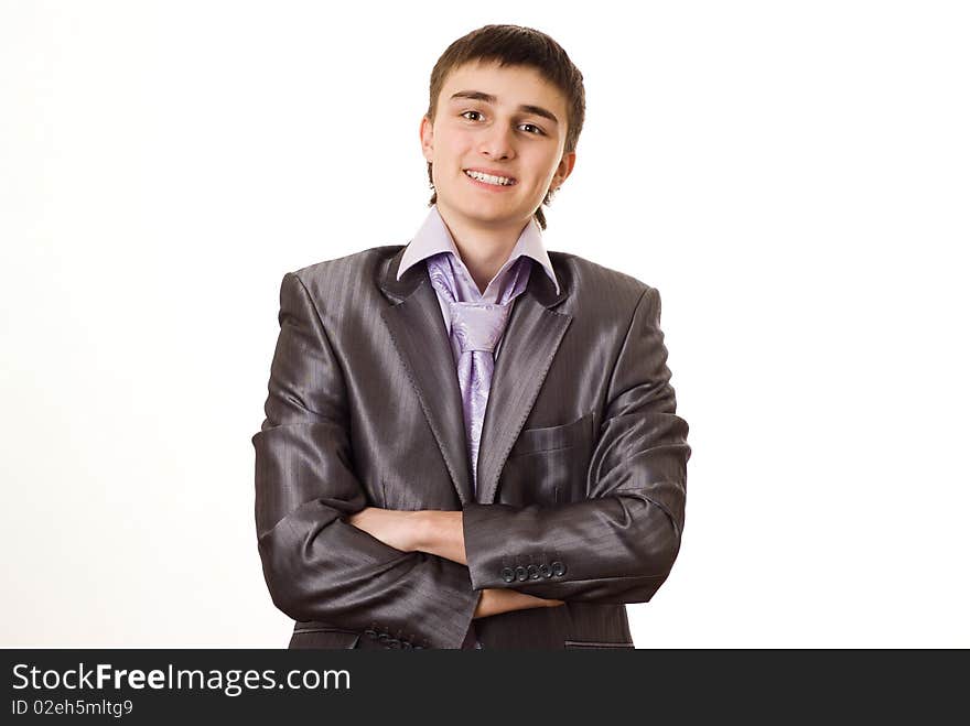 Handsome young businessman standing on white