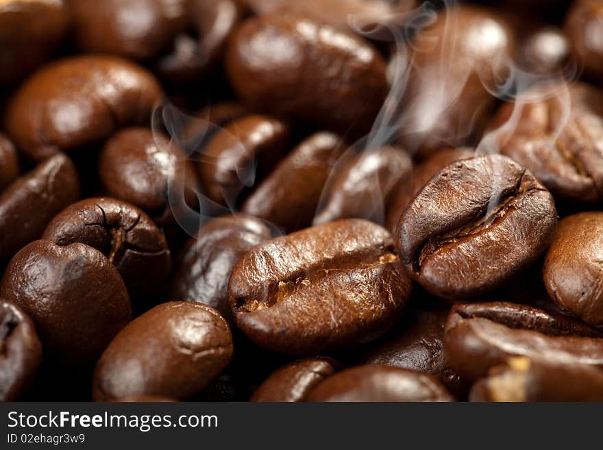 Hot roasted coffee beans background