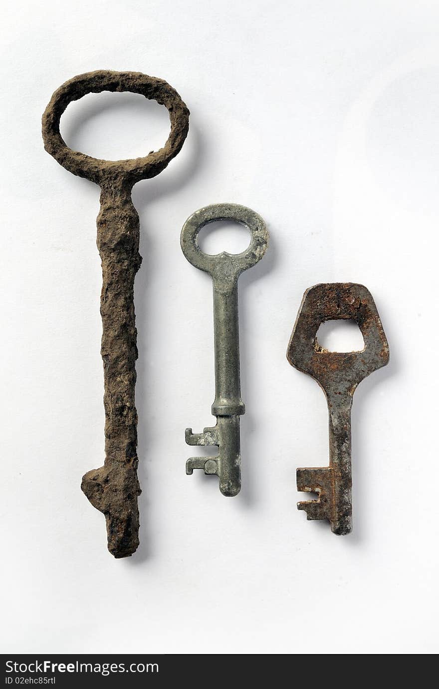 Three vintage rusty keys, closeup image. Three vintage rusty keys, closeup image