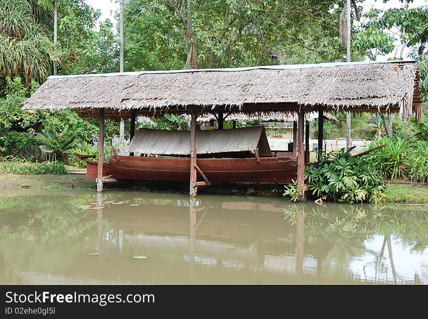 Nipa palm hut on water for boat storage