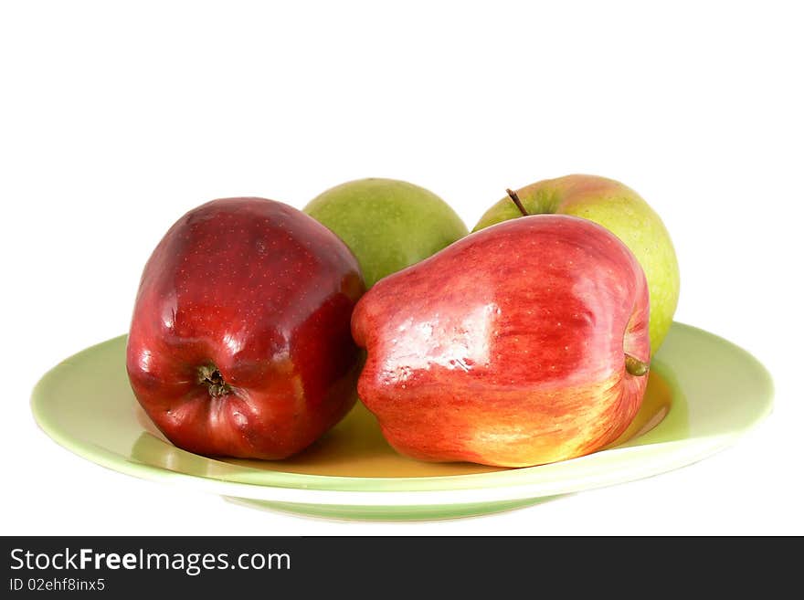 Apples on the plate, isolated on the white