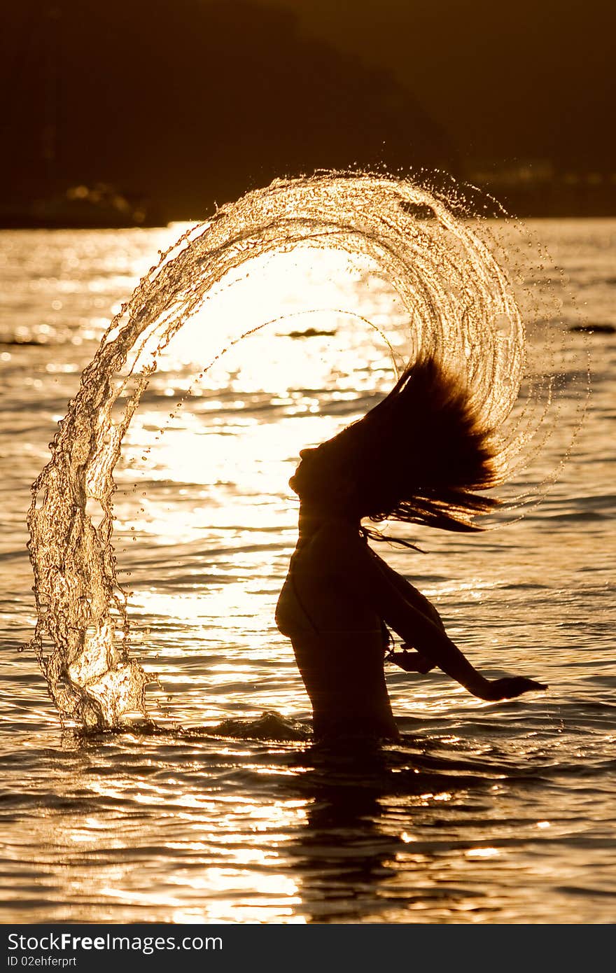 Girl with long hair playing in the sea. Girl with long hair playing in the sea