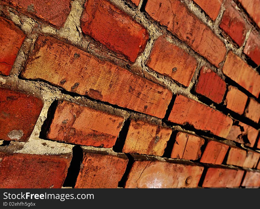 Laying from a red old brick covered by a sunlight. Laying from a red old brick covered by a sunlight