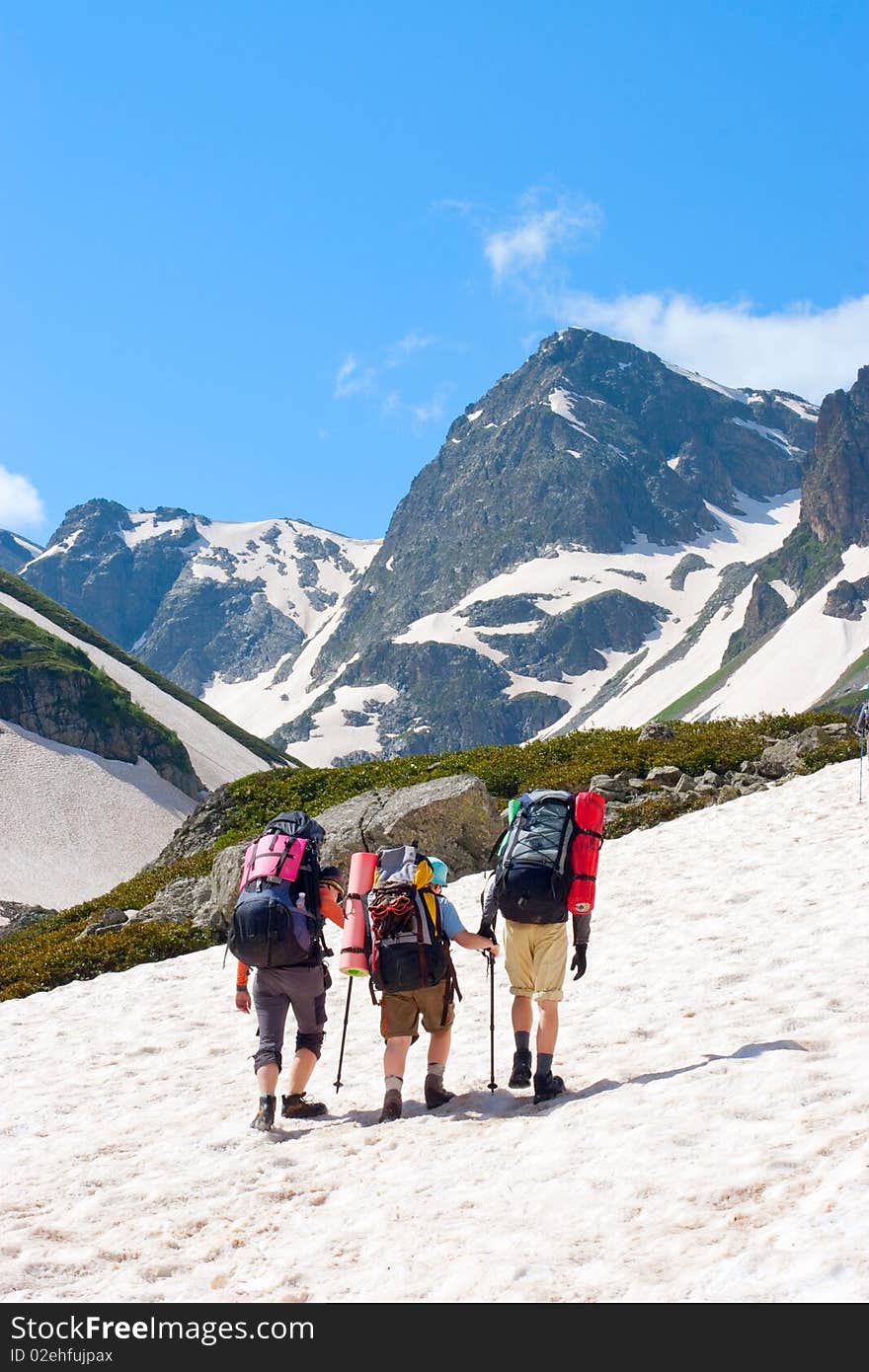 Hiker family in Caucasus mountains