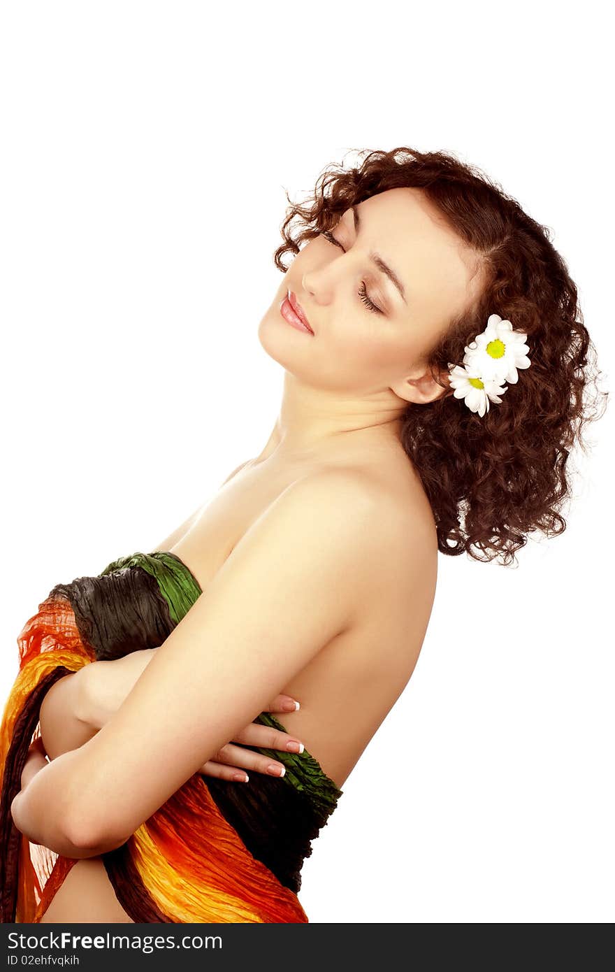 Beautiful woman with camomile flower on white background