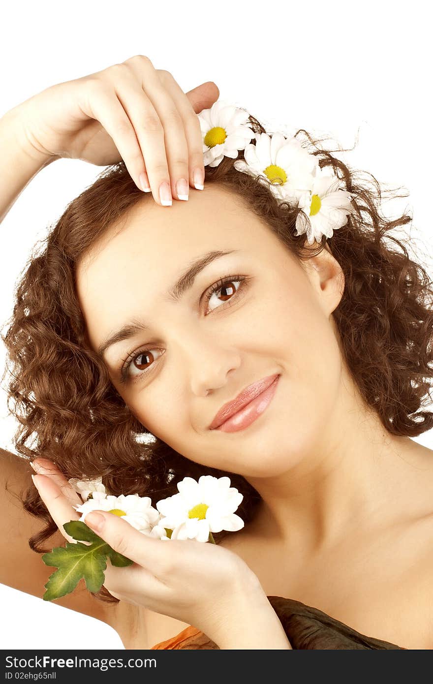 Beautiful woman with camomile flower