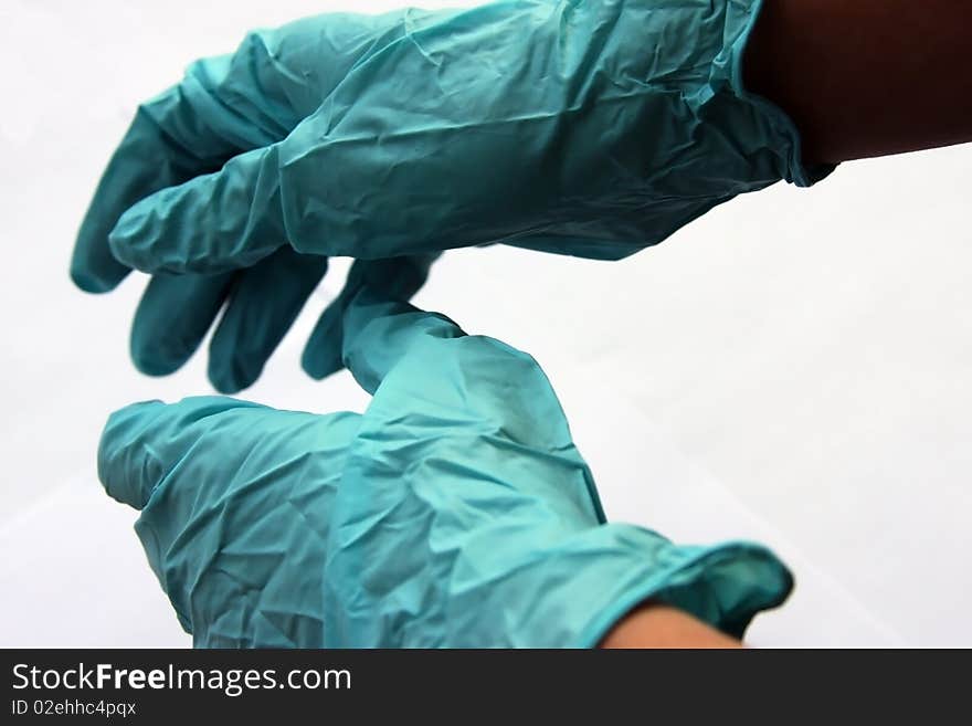 Doctor hands with surgical gloves trying to help the patient. Doctor hands with surgical gloves trying to help the patient